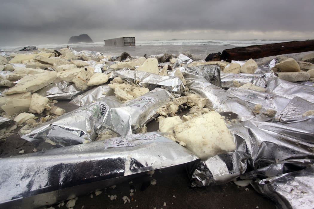 Material from spilt containers from MV Rena litter the beach at Mount Maunganui near Tauranga on 13 October, 2011.