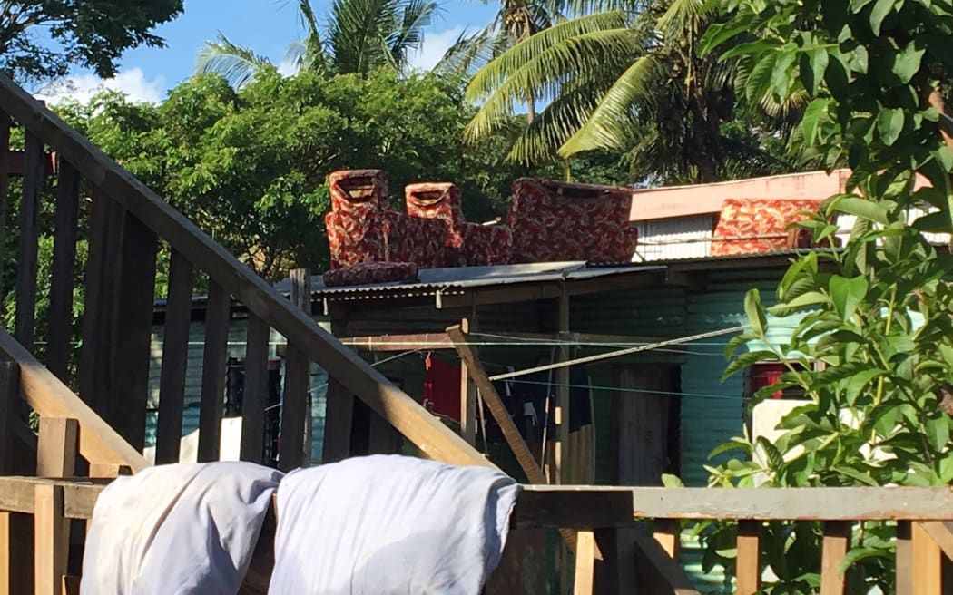 Furniture set out to dry on a roof in Nawaka