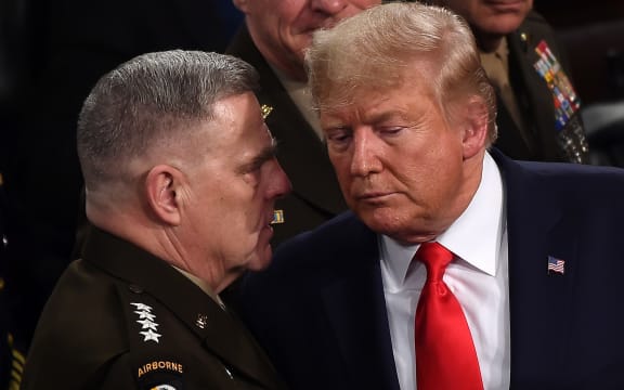 In this file photo taken on February 04, 2020, Chairman of the Joint Chiefs of Staff Gen. Mark Milley (L) chats with US President Donald Trump after he delivered the State of the Union address at the US Capitol in Washington, DC.