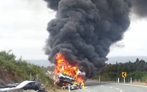The crashed vehicles were engulfed in flames after the crash.