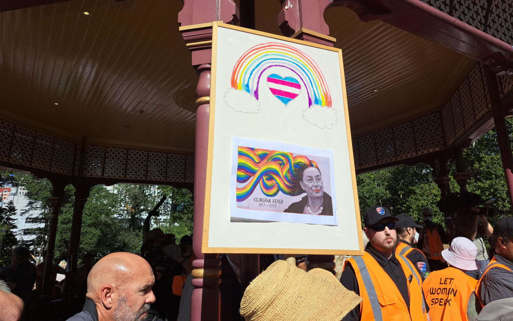 Placards with picture of Georgina Beyer, world’s first openly transgender MP, who died earlier in March, at the rally.