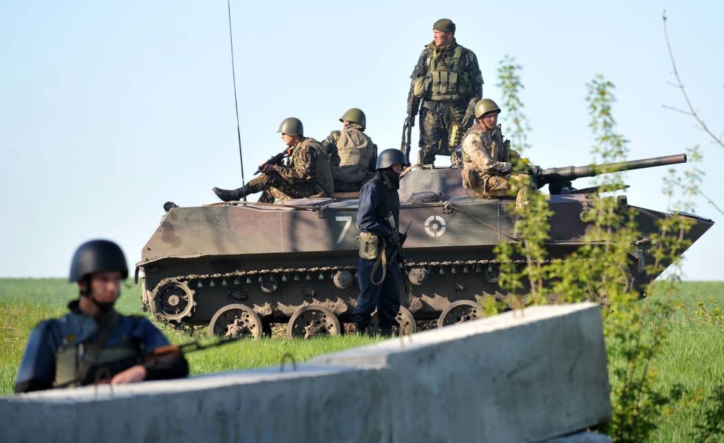 Ukrainian forces at a checkpoint near the eastern city of Slavyansk.