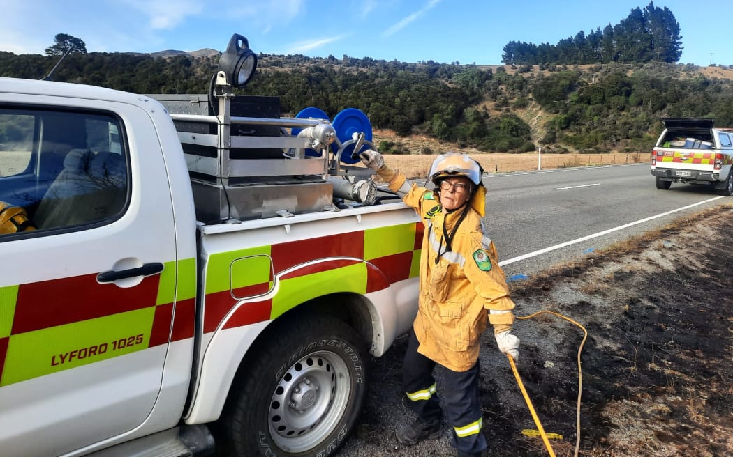 Dozens of firefighters remain at the site of a scrub fire on Lewis Pass Road in Canterbury, working to extinguish the blaze that forced evacuations yesterday.