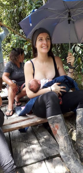 Lene Schulte travelling to Iquitos by boat with baby Amaya