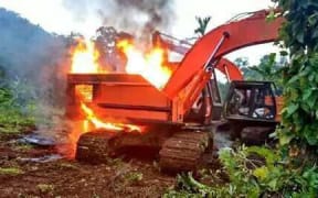 Logging equipment being burnt on Vanikoro, 2016.