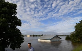 A shed inundated by floodwaters is seen on the banks of the overflowing Clarence River in Grafton, some 130 kms from the New South Wales town of Lismore on March 1, 2022.