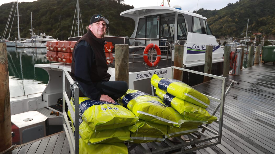 Cougar Line skipper Steve Kyle has a load of horse feed ready to be delivered to residents trapped in the Marlborough Sounds. He has already delivered groceries, dog biscuits and chicken feed.