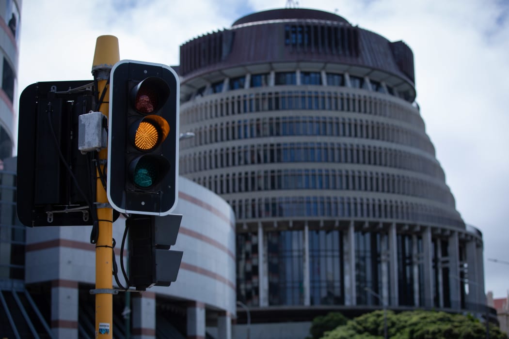 Orange Traffic Light in front of Parliament