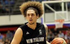 The Tall Blacks forward Isaac Fotu in action.