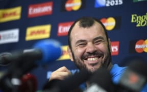 Australia's head coach Michael Cheika attends a press conference in Teddington, west London, on October 26, 2015.