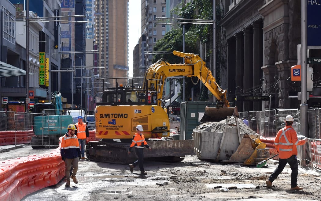 Workers are seen at the construction site of the 12 kilometer-long new light railway system in the central business district of Sydney on August 28, 2017. -