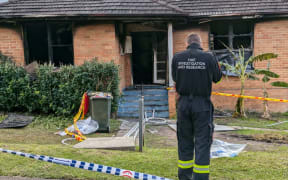 A man is in custody after three young children died in a house fire in Sydney overnight.