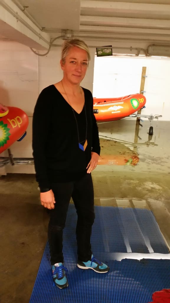 Maranui cafe co-owner Bronwyn Kelly standing in her flooded basement.