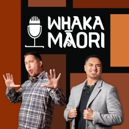Two Whakamāori hosts stand in front of tiles of different brown colours. The text behind them reads: “WHAKAMĀORI.”