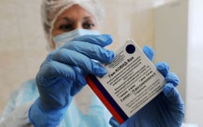 A medic demonstrates a package of Russia's Gam-COVID-Vac, trade-named Sputnik V coronavirus vaccine, in the Gorelskaya outpatient clinic of the Tambov Central District Hospital, in the village of Goreloe, Tambov region, Russia.