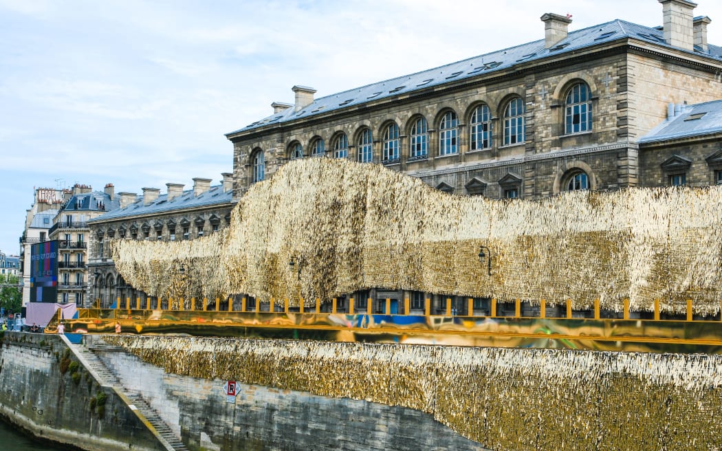 Certain buildings are being covered in gold on the banks of the Seine on the route of the opening ceremony of the Paris 2024 Olympic Games. (Photo by Vincent Koebel/NurPhoto) (Photo by Vincent Koebel / NurPhoto / NurPhoto via AFP)