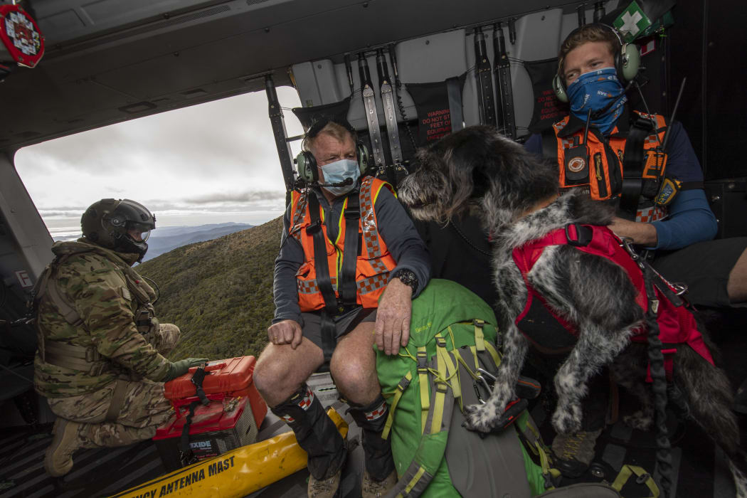 Defence Force helicopter assists NZ Police and LandSAR with a search and rescue operation to find two missing trampers in the Kahurangi National Park.