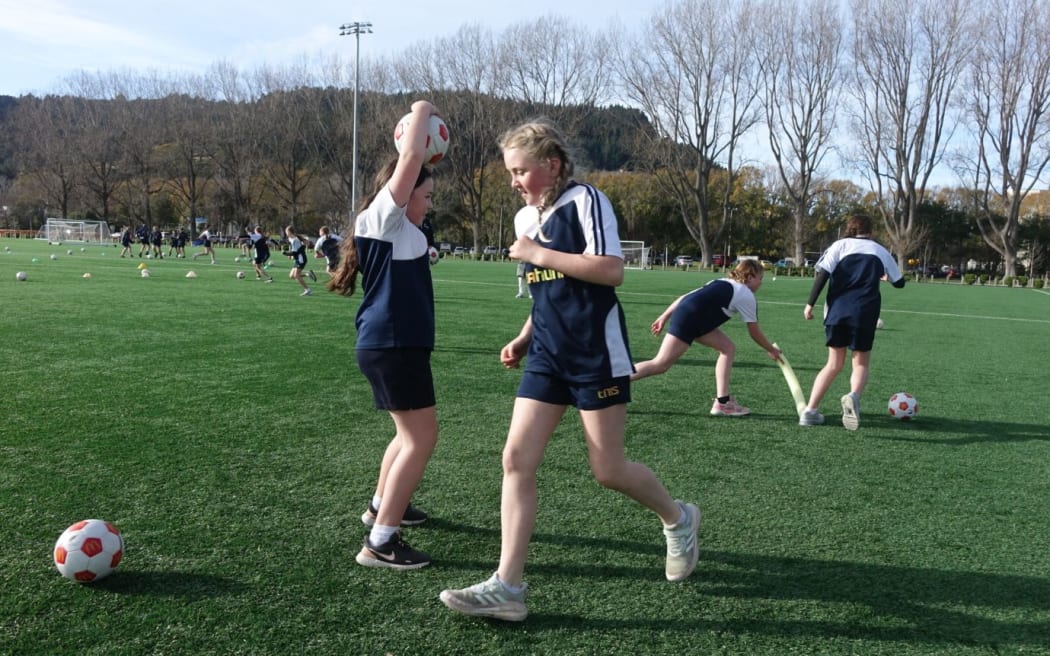 Girls doing football drills