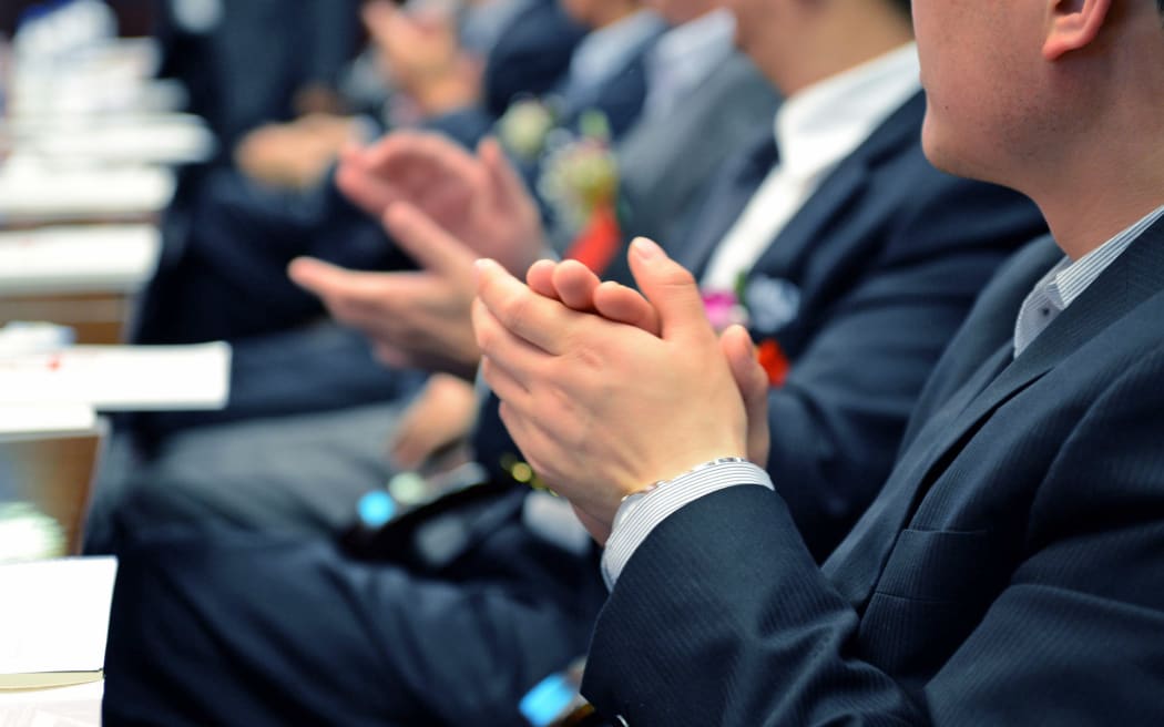 Men clapping