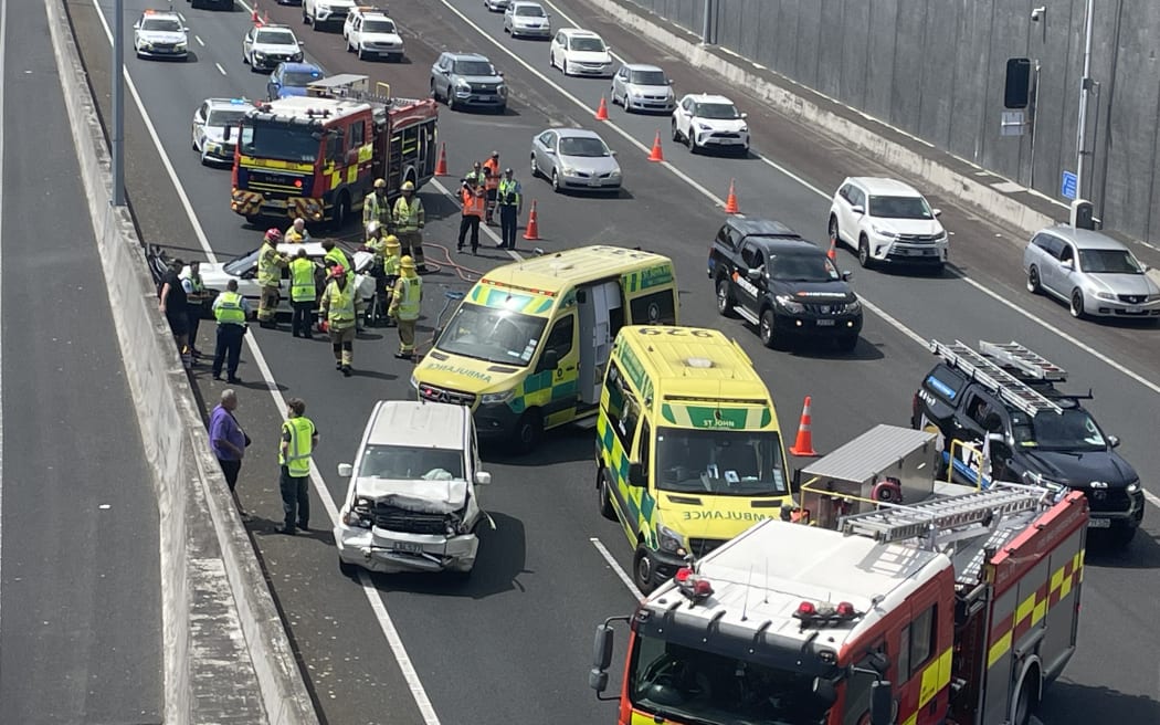 Emergency services attend a crash on Auckland's Southwestern Motorway, near Waterview Tunnel.