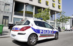 A police vehicle parked outside a student residence in Paris on 22 April 2015.