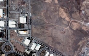 Satellite imagery shows airstrike craters over underground centrifuge halls filled and covered with dirt in Natanz nuclear enrichment facility in central Iran.