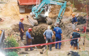 An old photo Daveena Dawrant has collected shows her garden dug up and remediation works, where an abandoned well was discovered.