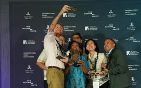 Tom Grundy of Hong Kong Free Press and Philippine Star Ana Marie Pamintuan with awards for courage and impact in journalism in Asia.