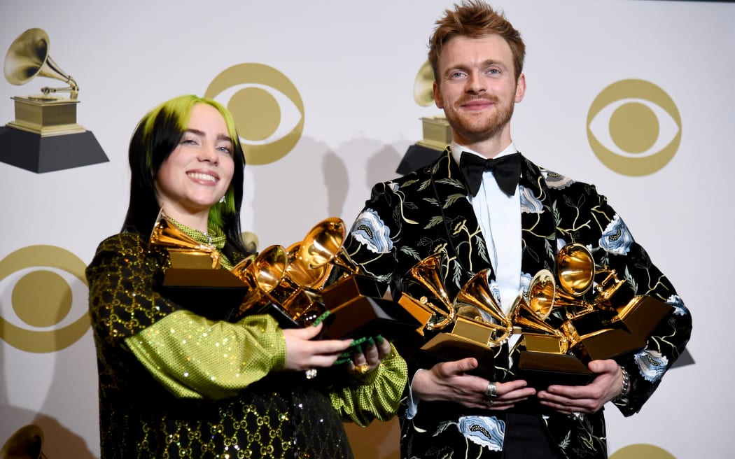 18-year-old pop star Billie Eilish and her brother and producer Finneas O'Connell with their combined Grammys haul.