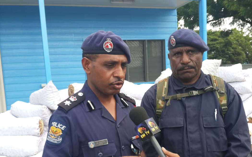 Papua New Guinea Police National Capital District (NCD) Metropolitan Commander Andy Bawa (left).