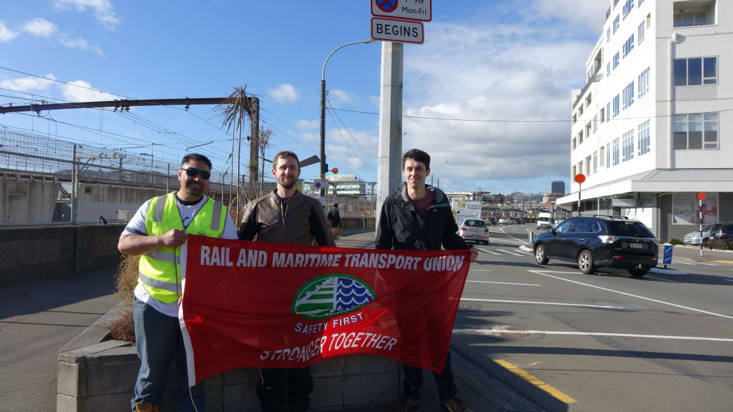 Union members picket outside the train maintenance depot on Thorndon Quay, Wellington.