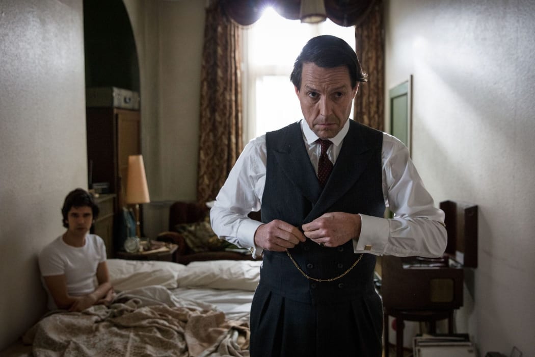 Hugh Grant as Jeremy Thorpe, leaving another ill-fated assignation with Norman Scott (Ben Whishaw).