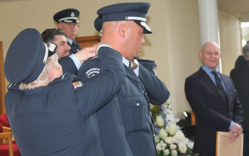 Quentin Manuel gets his epaulette to become a Corrections officer.