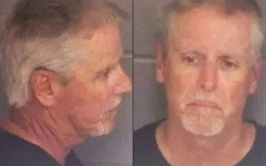 This booking photo obtained on September 6, 2024 from the Barrow County Sheriff's Office, shows Colin Gray, the father of Colt Gray, the suspect in the shooting at Apalachee High School in Winder, Georgia. A 14-year-old boy was charged with shooting four people dead at a US high school, while his father was charged with manslaughter, authorities said Thursday, after the country's latest outburst of gun violence. (Photo by Handout / Barrow County Sheriff's Office / AFP) / RESTRICTED TO EDITORIAL USE - MANDATORY CREDIT "AFP PHOTO / Barrow County Sheriff's Office" - NO MARKETING NO ADVERTISING CAMPAIGNS - DISTRIBUTED AS A SERVICE TO CLIENTS