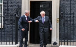 British Prime Minister Boris Johnson greets Australian Prime Minister Scott Morrison outside the door of 10 Downing Street, London, UK on 14th June 2021.