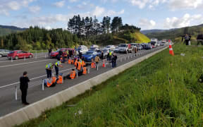 Protesters block traffic on Transmission Gully, Wellington, on 19 October 2022.