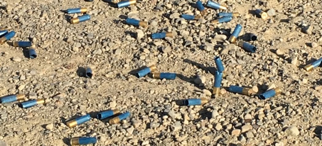 Used shotgun shells on the Okuku River bed.