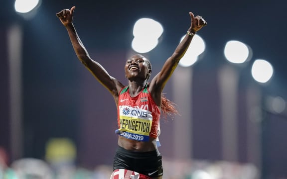 28 September 2019, Qatar, Doha: Athletics, World Championships, Marathon, Women. Ruth Chepngetich from Kenya rejoices after her victory.