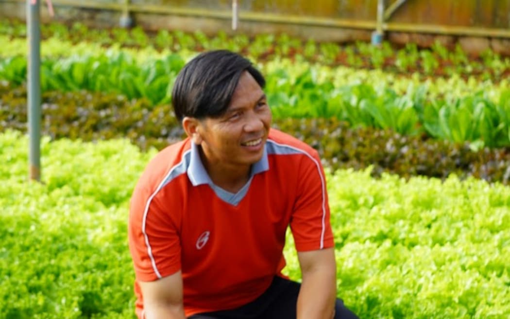 Wiwat from the Aka tribe pictured in his greenhouse in Wawee in Chiang Rai.