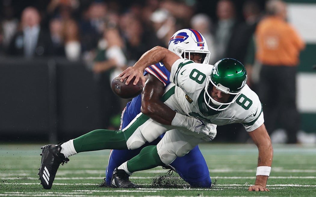 Jets quarterback Aaron Rodgers of the New York Jets sacked by Bills defensive end Leonard Floyd.