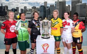 Cook Islands Moana captain Te Kura Ngata-Aerengamate (2L) and Papua New Guinea Orchids skipper Cathy Neap (R) at the Women's World Cup launch.