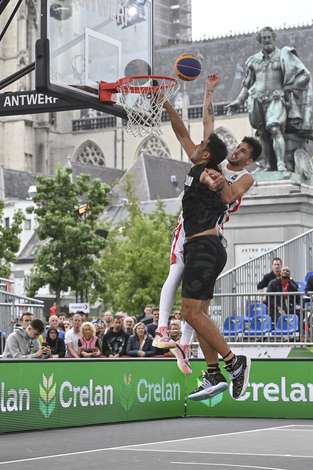 France's Franck Seguela (R) and New Zealand's Tai Wynyard fights for the ball during a 3x3 Basketball game between France and New Zealand, in the Men's qualifying round of the FIBA 2022 World Cup, on June 21, 2022. The tournament of The 2022 FIBA 3x3 World Cup runs between 21 and 26 June 2022 in Antwerp, Belgium. (Photo by DIRK WAEM / BELGA / AFP) / Belgium OUT