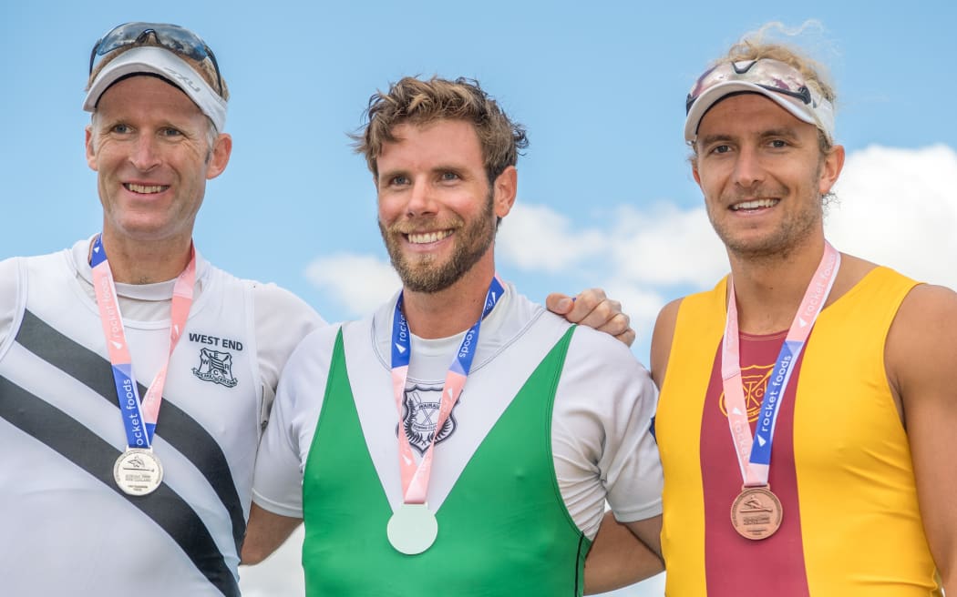Mahe Drysdale (lelt) , Robbie Manson (centre) and Jordan Parry on the podium after the men's single scull at the national champs in February.