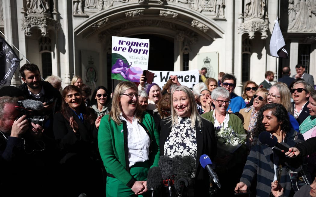 Susan Smith (L) and Marion Calder, Directors of For Women Scotland make a statement outside Britain's Supreme Court in London on April 16, 2025, following the court's ruling on how to define a 'woman'. Britain's Supreme Court said the legal definition of a "woman" is based on a person's sex at birth, a landmark ruling with far-reaching implications to the bitter debate over trans rights. In a win for Scottish gender-critical campaigners who brought the case to the UK's highest court, five London judges unanimously ruled "the terms 'woman' and 'sex' in the Equality Act 2010 refer to a biological woman, and biological sex". (Photo by HENRY NICHOLLS / AFP)
