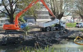 Quake repair work continues on the banks of the Avon River.