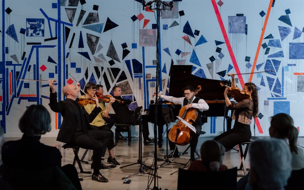 Musicians of the 2024 At The World's Edge Festival on stage.