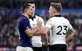 France's Thomas Ramos and New Zealand's Damian McKenzie talk after the match.