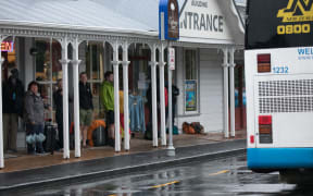 People escaping the rain in Paihia.
