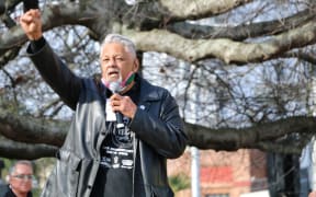 Will 'Ilolahia of the Polynesian Panthers raises his fist along with protesters as he speaks at the Black Lives Matter rally in Auckland's Aotea Square on 14 June, 2020.
