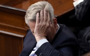 US Republican Representative of California Kevin McCarthy listens as lawmakers take a 13th vote for House Speaker at the US Capitol in Washington, DC, on January 6, 2023. - McCarthy took a significant step to securing the gavel Friday after three days of deadlock as he managed to win over most of the 20 hardline fellow Republicans blocking his path. The party, which has a razor-thin majority in the lower chamber of Congress, was facing worsening infighting after McCarthy lost a historic 12 consecutive ballots for the job. (Photo by OLIVIER DOULIERY / AFP)